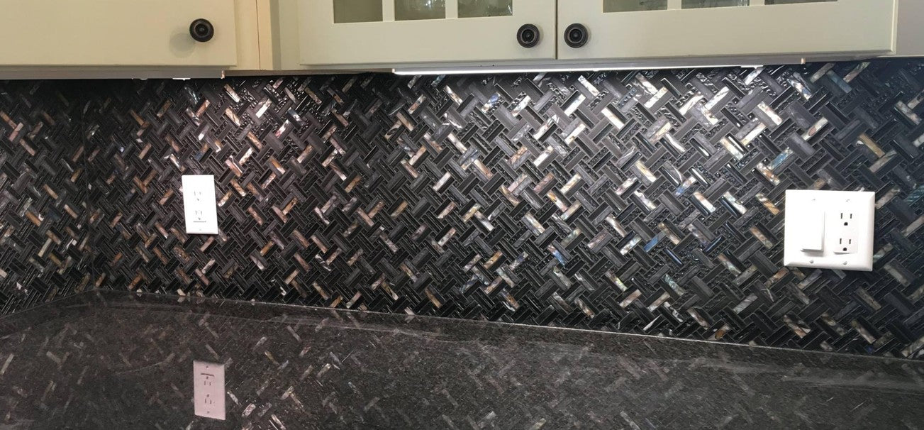 Mixing different types of backsplash materials to create a unique look